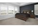 Spacious bedroom with a large bed, neutral decor, and large windows providing natural light at 5128 Preserve Pl, Firestone, CO 80504
