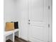 This entryway features a bench with cushions and a door with modern hardware at 5128 Preserve Pl, Firestone, CO 80504