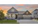 Beautiful two-story home featuring a covered porch, two-car garage, and well-maintained lawn at 5128 Preserve Pl, Firestone, CO 80504