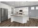 Modern kitchen featuring stainless steel appliances, granite countertops, and a spacious island at 5128 Preserve Pl, Firestone, CO 80504