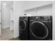 This well-equipped laundry room features side-by-side washer and dryer units at 5128 Preserve Pl, Firestone, CO 80504
