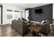 Comfortable living room featuring modern furnishings, hardwood floors and plenty of sunlight at 5128 Preserve Pl, Firestone, CO 80504