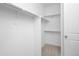 Walk-in closet with shelving, carpeting, and ample storage space at 5128 Preserve Pl, Firestone, CO 80504