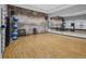 Yoga and stretching studio with hardwood floors, fitness equipment, and mirrors at 5128 Preserve Pl, Firestone, CO 80504