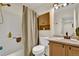 Well-lit bathroom with a shower-tub combination and updated fixtures at 165 Montgomery Dr, Erie, CO 80516
