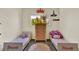 bedroom with twin beds, colorful decor, and a window providing ample natural light at 165 Montgomery Dr, Erie, CO 80516