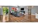 Bright living room featuring wood floors, neutral paint, modern furnishings, and lots of natural light at 165 Montgomery Dr, Erie, CO 80516