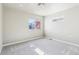 Empty bedroom featuring neutral walls, plush carpet, natural light, and carpet at 5760 N Boston St, Denver, CO 80238