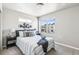 Cozy bedroom with natural light and a comfortable queen-sized bed at 5760 N Boston St, Denver, CO 80238