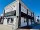 Bright commercial building featuring a Pizza and Ice Cream store with modern black awnings at 5760 N Boston St, Denver, CO 80238