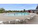 Relax by the community pool with modern lounge chairs, umbrellas, and nearby neighborhood homes at 5760 N Boston St, Denver, CO 80238