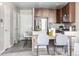 Kitchen features stainless steel appliances, granite countertops and a modern design at 5760 N Boston St, Denver, CO 80238