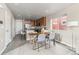 Cozy kitchen with wood dining table and seating near the kitchen island and cabinets at 5760 N Boston St, Denver, CO 80238