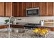 The kitchen features stainless steel appliances, granite countertops, and modern cabinetry at 5760 N Boston St, Denver, CO 80238