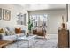 Bright living room with large windows, hardwood floors and neutral color palette at 5760 N Boston St, Denver, CO 80238