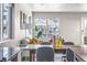 Bright living room with large windows and comfortable seating areas at 5760 N Boston St, Denver, CO 80238