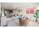 Bright, modern living room and dining area with wood floors and an open layout at 5760 N Boston St, Denver, CO 80238