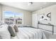 Bright main bedroom featuring a large window and stylish decor at 5760 N Boston St, Denver, CO 80238