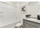 Clean bathroom with tub-shower combo, modern fixtures, and gray granite countertop at 4723 Windmill Dr, Brighton, CO 80601