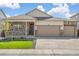 Charming single-Gathering home with a stone-accented facade and a spacious three-car garage at 4723 Windmill Dr, Brighton, CO 80601