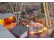 Aerial view of a backyard featuring a fire pit, hot tub, garden and outdoor entertainment space at 6334 S Elati St, Littleton, CO 80120