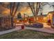 Backyard with fire pit, seating, and mature trees, perfect for outdoor gatherings at 6334 S Elati St, Littleton, CO 80120