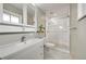 Bathroom with a stand-up glass shower, modern vanity, and tiled floors at 6334 S Elati St, Littleton, CO 80120
