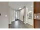 Spacious foyer with tile flooring, leading to the living areas and kitchen at 6334 S Elati St, Littleton, CO 80120