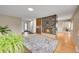 Open-concept living space with marble fireplace and hardwood floors at 6334 S Elati St, Littleton, CO 80120