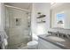 Modern bathroom with walk-in shower, sleek vanity, and contemporary fixtures at 7745 S Trenton Ct, Centennial, CO 80112