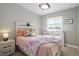 Cozy bedroom with natural light, decorative pillows, and stylish furniture at 7745 S Trenton Ct, Centennial, CO 80112