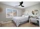 This bedroom features a modern design, window with blinds, and a comfortable bed at 7745 S Trenton Ct, Centennial, CO 80112