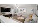 Spacious living room featuring recessed lighting, hardwood floors, and a modern ceiling fan at 7745 S Trenton Ct, Centennial, CO 80112