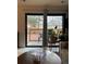 Living room view of back porch features sliding glass doors and outdoor seating at 1901 Clear Creek Dr # A-104, Georgetown, CO 80444
