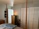 Bedroom with four-poster bed, white closet, and decorative furniture at 1901 Clear Creek Dr # A-104, Georgetown, CO 80444