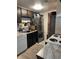 Functional kitchen with stainless steel appliances, dark cabinets, and practical layout at 1901 Clear Creek Dr # A-104, Georgetown, CO 80444