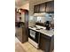 Kitchen features classic cabinets and an efficient oven range at 1901 Clear Creek Dr # A-104, Georgetown, CO 80444
