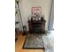 Living room with a decorative fireplace, stone hearth and soft lighting at 1901 Clear Creek Dr # A-104, Georgetown, CO 80444