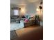 Cozy living room features a comfortable sectional sofa and a plush area rug at 1901 Clear Creek Dr # A-104, Georgetown, CO 80444