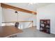 Bonus room with vaulted ceilings, wooden beams, carpet floors, and a large desk at 5821 S Quatar Cir, Centennial, CO 80015