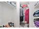 Organized walk-in closet with clothing racks, shelves, and overhead storage for optimized organization at 5821 S Quatar Cir, Centennial, CO 80015