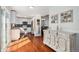 Modern kitchen with stainless steel appliances, white cabinetry, and natural light streaming in from the windows at 5821 S Quatar Cir, Centennial, CO 80015