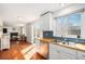 Stylish kitchen with stainless steel appliances, wooden countertops, and view of the living room at 5821 S Quatar Cir, Centennial, CO 80015