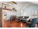 Bright living room with high ceilings, hardwood floors, and a cozy seating area at 5821 S Quatar Cir, Centennial, CO 80015