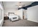 Large main bedroom with ensuite bathroom, ceiling fan, stylish decor, and abundant closet space at 5821 S Quatar Cir, Centennial, CO 80015