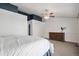 Main bedroom with vaulted ceilings, ceiling fan, neutral tones, ensuite bath, and natural light at 5821 S Quatar Cir, Centennial, CO 80015