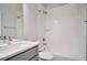 Bathroom featuring a tiled shower over tub with modern fixtures and bright lighting at 1919 W 46Th Ave # 3, Denver, CO 80211