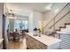 Contemporary kitchen featuring a center island, stainless steel appliances, and seamless flow to a cozy dining area at 1919 W 46Th Ave # 3, Denver, CO 80211