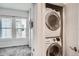 Conveniently located laundry area with stacked washer and dryer and storage at 1919 W 46Th Ave # 3, Denver, CO 80211