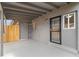 Private back patio with access door and wood fence at 1440 S Logan St, Denver, CO 80210